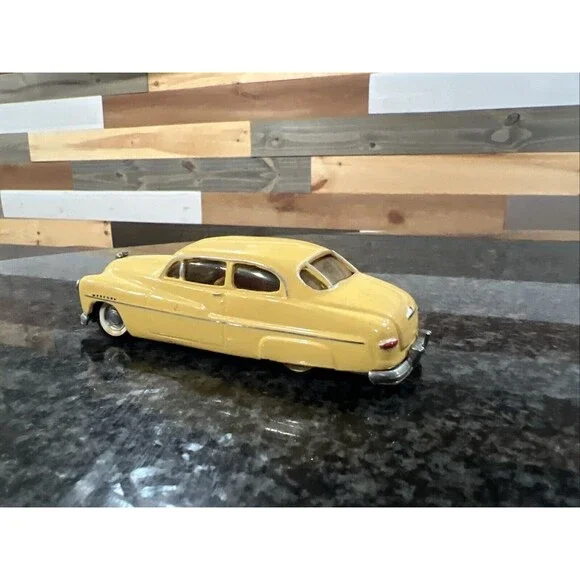 1:43 EMPIRE ZAUGG MODEL TIN WIZARD 6 MERCURY 51 1951 YELLOW